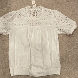 Women’s size medium short sleeve white t-shirt.  New with tags.